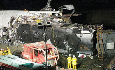 Cleanup crews sort through train wreckage