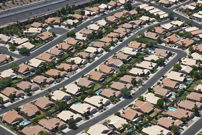 Similarly shaped and sized houses in a suburban neighborhood